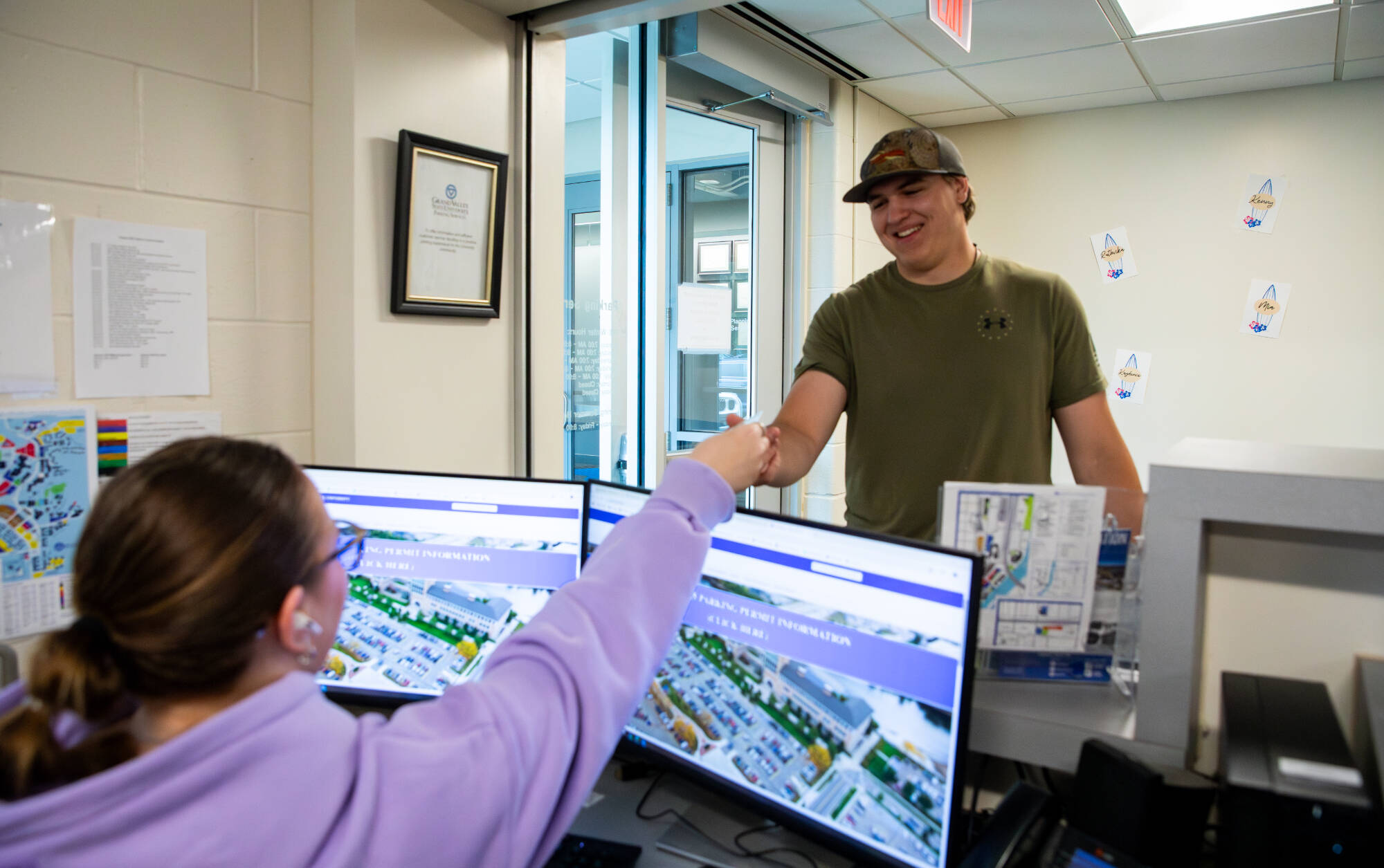 students at parking services getting help